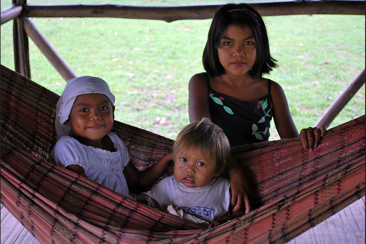 Three children in an indigenous community near Puerto Narino, Amazonas. 