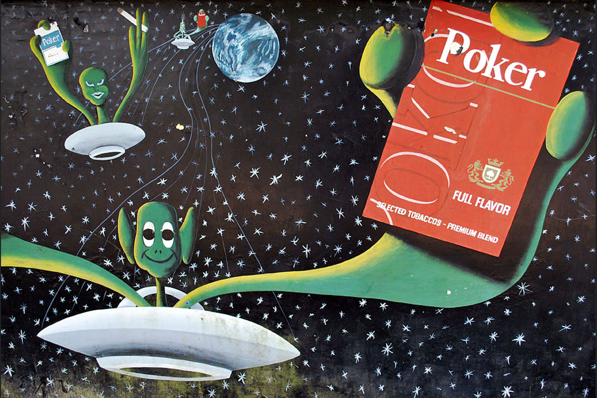 Walter Raleigh was the first European to take tobacco from the Americas to Europe; now the aliens are bringing it home. A billboard in Leticia, Amazonas.